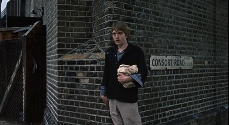 blowup-1966-016-thomas-standing-under-brickwork-consort-road